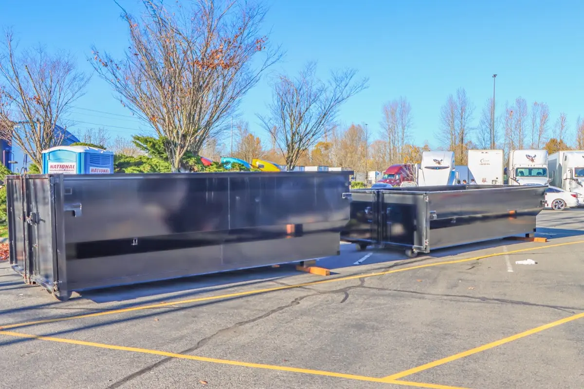 Professional dumpster rental service with roll-off container on residential driveway in Schertz